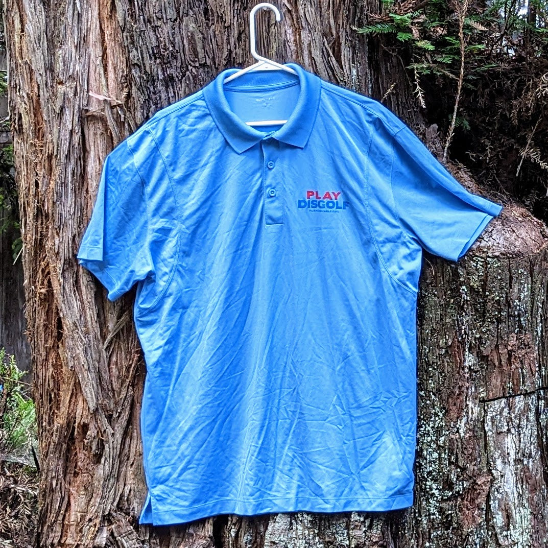 Clearance- Light blue performance polo with the Play DiscGolf logo front and Languages Grid version of logo on back, Size XL