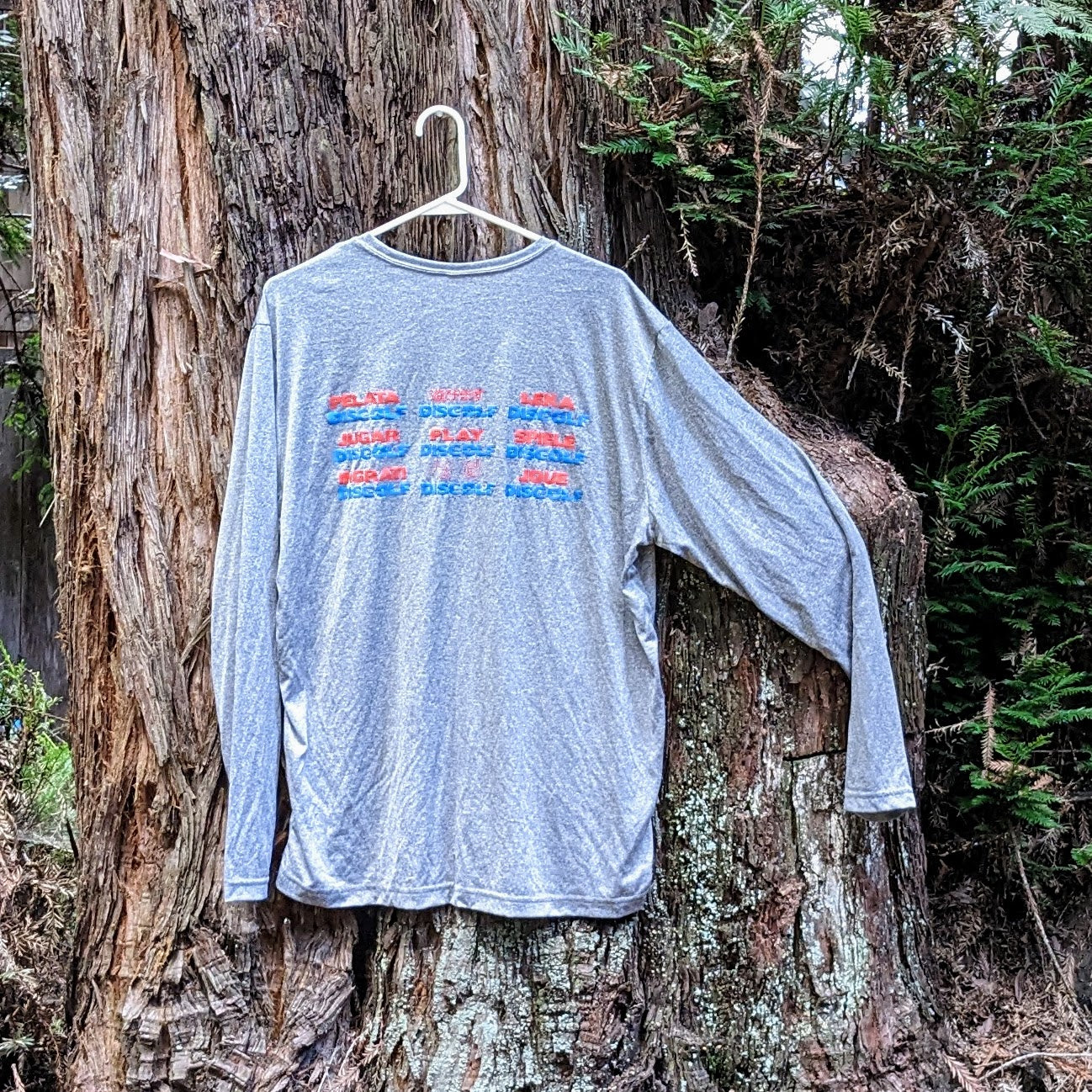 Clearance- Gray Long Sleeve with the Play DiscGolf logo front and Languages Grid version of logo on back, Size XL